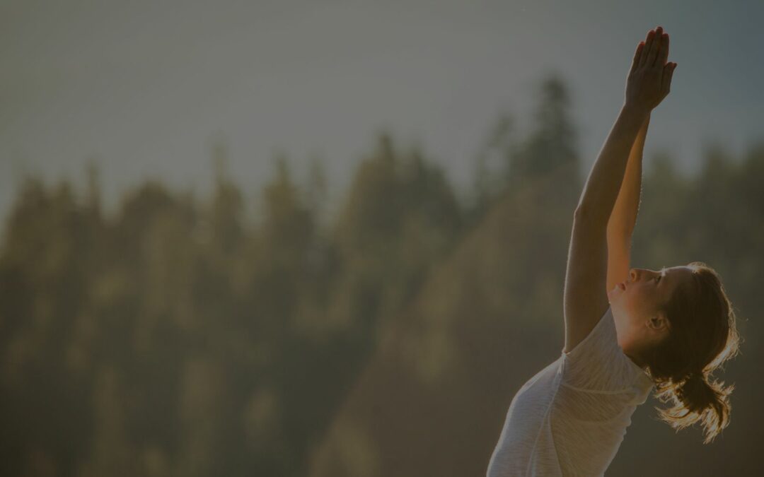 woman practicing yoga in nature